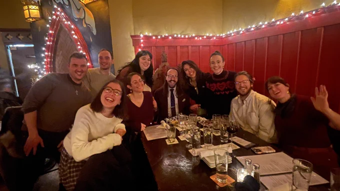 Me in a thronelike chair at a bar, surrounded by nine people: a handful of longtime classmates/coworkers/D&D co-adventurers, my partner Sarah, and my best friend couple Max and Ashley, who traveled all the way from Philadelphia to celebrate with me for the weekend.