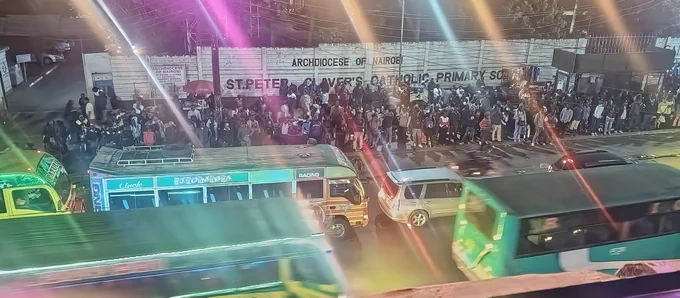 This is a terminus in downtown Nairobi. Passengers stood waiting for matatus for over 4 hours. It was at 21:00hrs and I imagined many came from work at around 18:00hrs only to find no buses at the terminal. I also thought that many are parents with children to bond with at home  after work and in the morning they were expected to report to their respective hustles without getting late. Think of mental health, think of pollution, mental and work stress, lack of enough rest and sleep, unpredictable fares - we are bound to intensively discuss this issue of public transport with all stakeholders to see how we can improve the existing system. In the picture there were some women with children, a pregnant woman and persons abled differently and thanks to nature because there was no rain. Someone come in and intervene for the safety of passengers in #OurPublicTransport