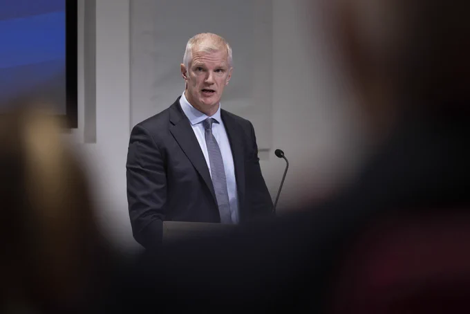 Minister for the Armed Forces delivering a keynote speech at a lectern.