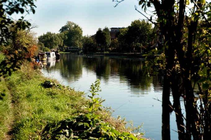 Canal boats in the distance parked on the River Lea
