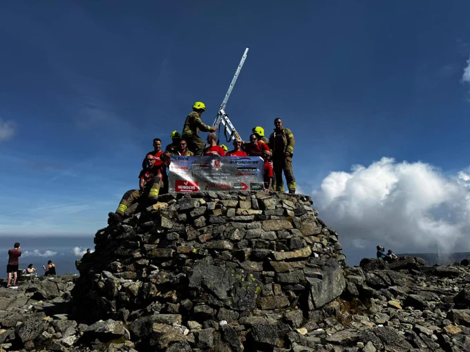 Halstead firefighters pitching a ladder on Mt Snowdon