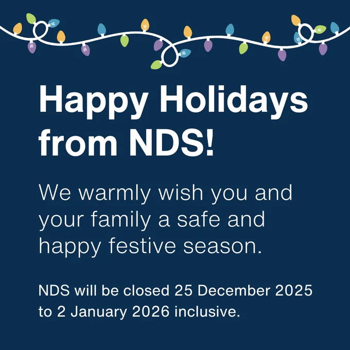 Navy background, with colourful christmas lights on top. Underneath, white text reads Happy Holidays from NDS!. We warmly wish you and your family a safe and happy festive season. NDS will be closed 25 December 2025 to 2 January 2026 inclusive.  