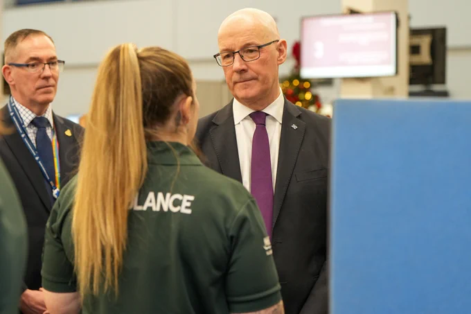 First Minister John Swinney with NHS 24 and Scottish Ambulance Service staff at Caledonia House, Glasgow.