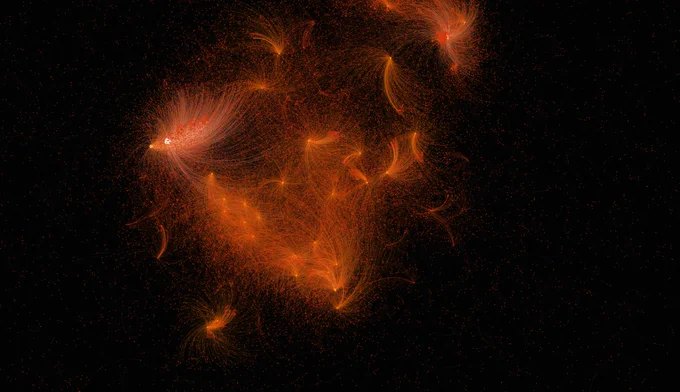 Red sparkles on black background.