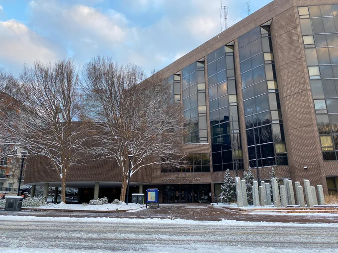 The front of Raleigh City Hall on a snowy day 