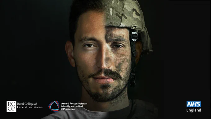 An image of a man in half civilian clothing, half military clothing
