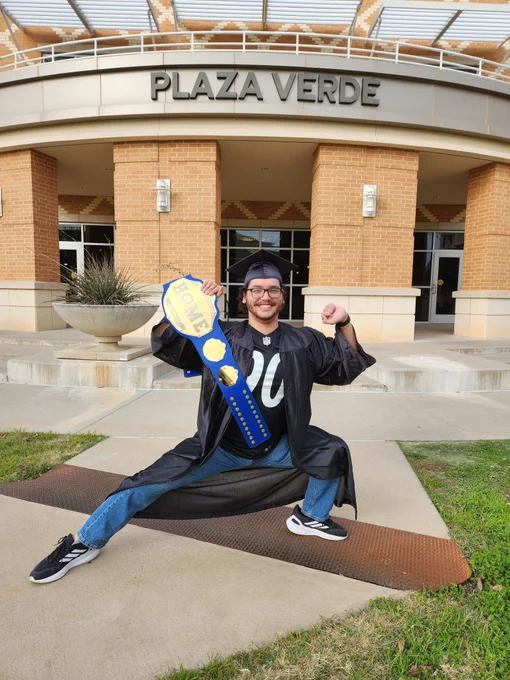 An Angelo State Housing Student staff member posing for graduation.