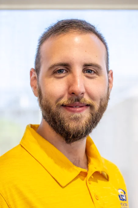 A portrait of an Angelo State Housing Student staff member posing.