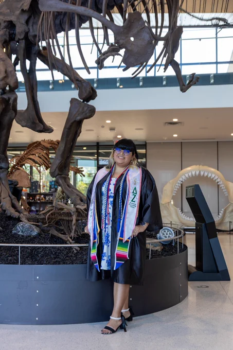 An Angelo State Housing Student Staff member posing for graduation.