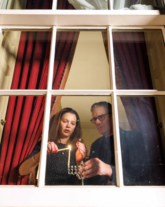 Prime Minister Keir Starmer and Victoria Starmer light a candle on the family Chanukiah and place it in the window of 10 Downing Street to mark the start of Chanukah.