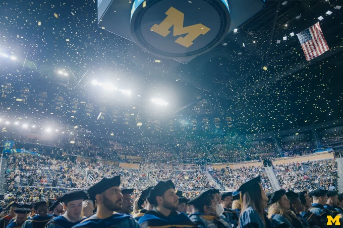 Confetti falling down at 2025 Winter Commencement at Crisler Center.