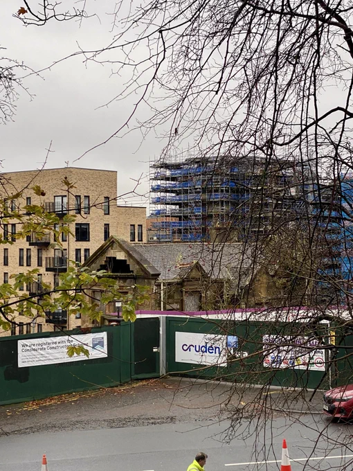 Taken three weeks ago, this is the gatehouse to the Victoria Infirmary at Glasgow’s Queens Park surrounded by hoardings and with new buildings of ‘The Victoria’ development under construction in the background.