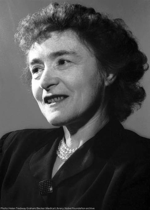 Black and white portrait of Nobel Prize laureate Gerty Cori, smiling and looking to the side.