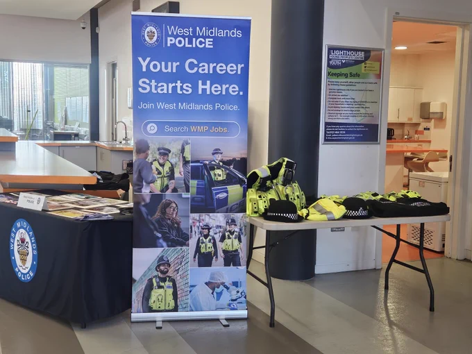 Set up of the police banner with the table and uniform