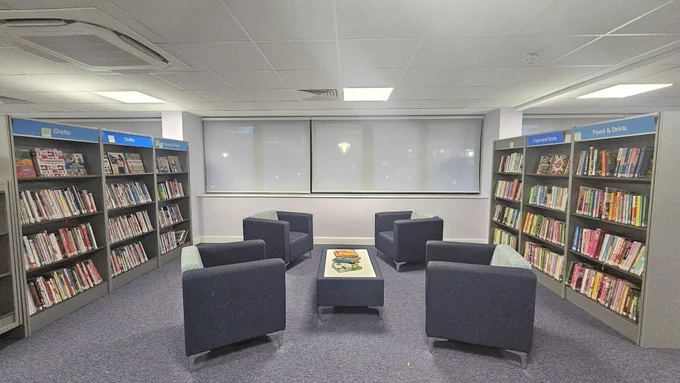 Reading area with bookcases at Orpington Library.