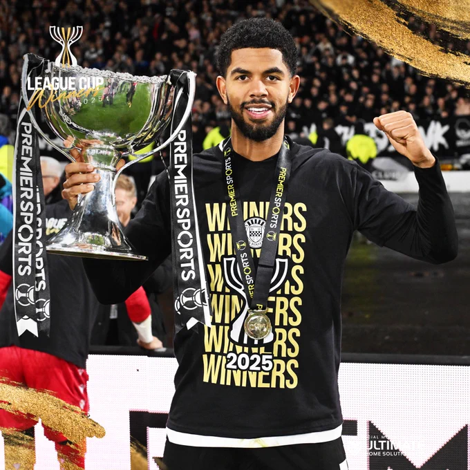Miguel Freckleton with the Premier Sports Cup trophy.