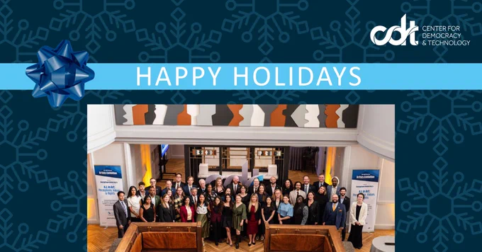 Center for Democracy and Technology holiday card. Blue snowflakes over a dark blue background, with a group image of the staff in the center.
