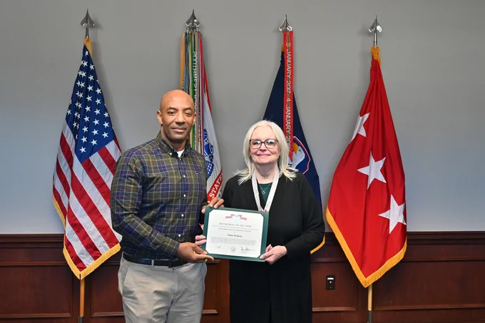 LTG Sean A. Gainey presents a retirement award to Elaine Waldrep
