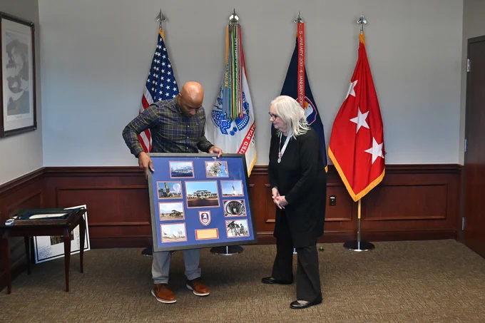 LTG Sean A. Gainey presents a retirement award to Elaine Waldrep