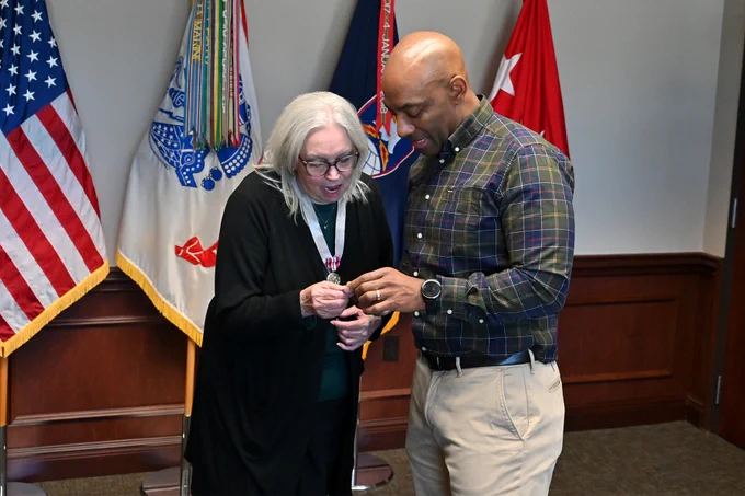 LTG Sean A. Gainey presents a retirement award to Elaine Waldrep