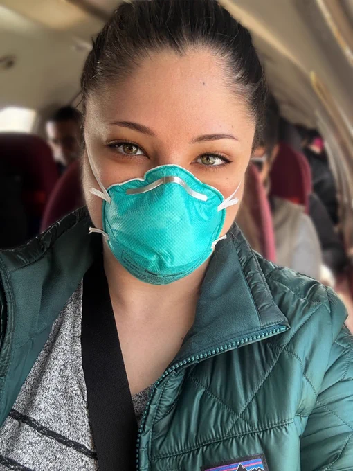 selfie in a respirator on a plane