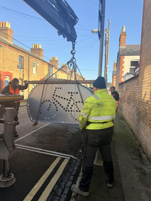 A BikeBunker is photographed being lowered into position on a Dublin street. 