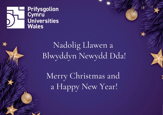 A festive holiday greeting card with a purple background decorated with gold stars and ornaments, along with dark purple pine branches in the corners. The text reads:
“Prifysgolion Cymru Universities Wales” at the top left, and in the center:
“Nadolig Llawen a Blwyddyn Newydd Dda! Merry Christmas and a Happy New Year!”