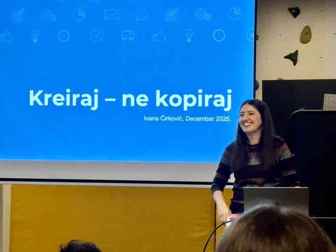 Ivana speaking at Belgrade WordPress Meetup with slide behind her reading "Create, don't copy"