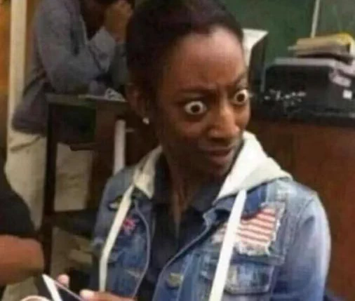 A reaction image of a shocked looking woman.