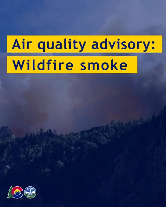 Wildfire smoke alert text highlighted in yellow on blue background over image of smoke rising above a hillside.
Logos at the bottom.
