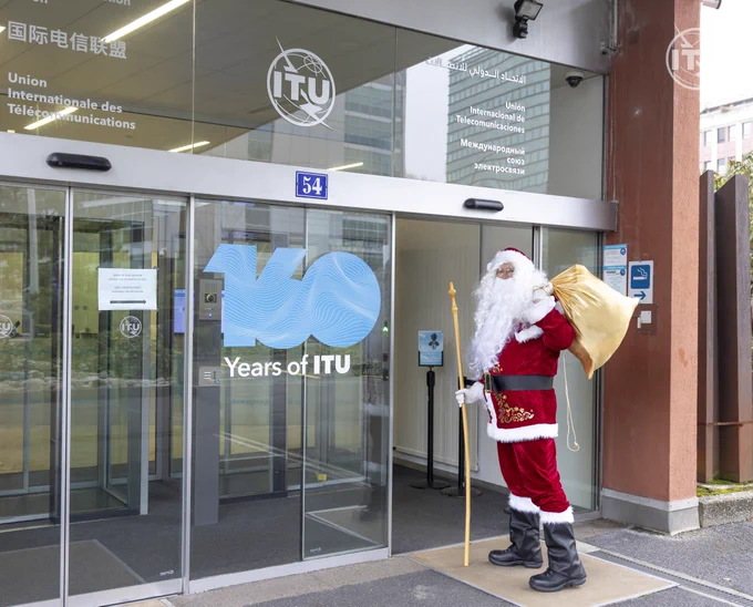 photo of Santa entering the front doors of our ITU Tower 