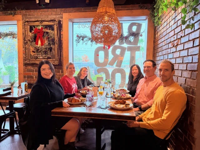 The Fuller Insurance team gathered together for a holiday group photo during their annual Christmas brunch at Bistrology Restaurant in Miramar Beach.