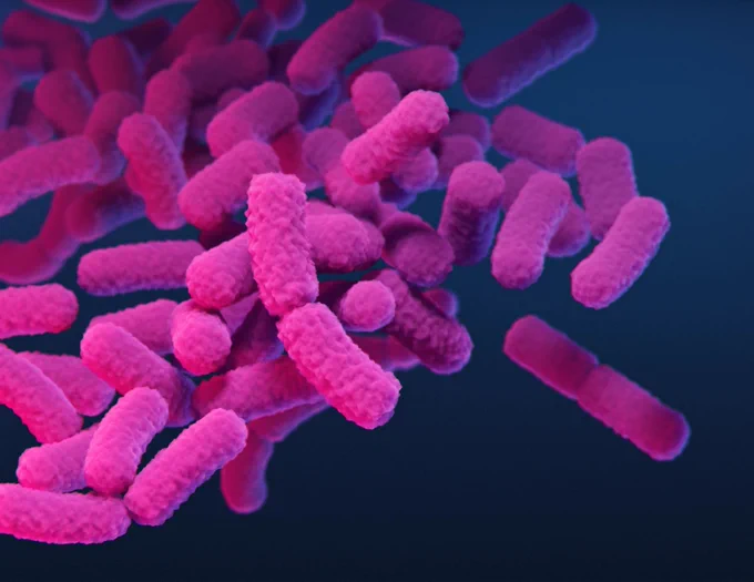 Illustration of purple bacteria on a blue background. 