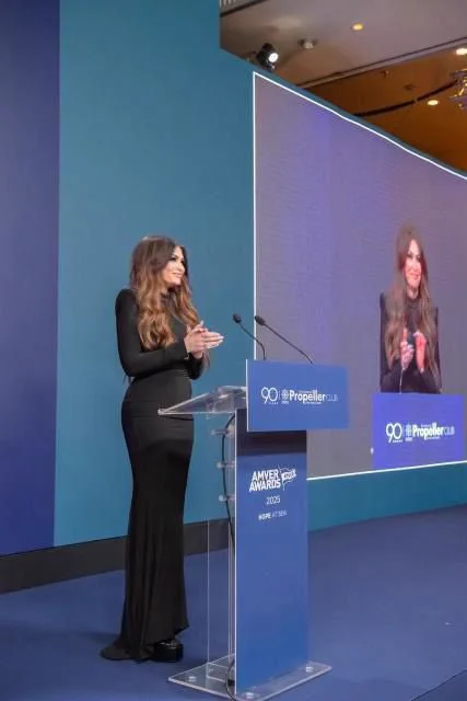 Ambassador Guilfoyle standing at the podium and delivering remarks at the Amver Awards Ceremony.
