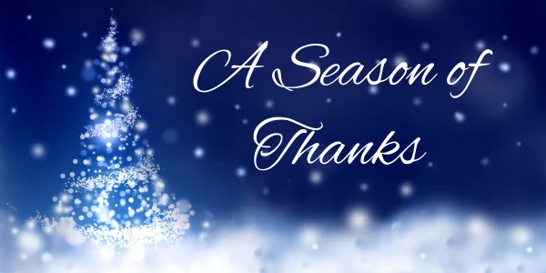 Image of blue twinkles and a tree with text that says “A Season of Thanks”