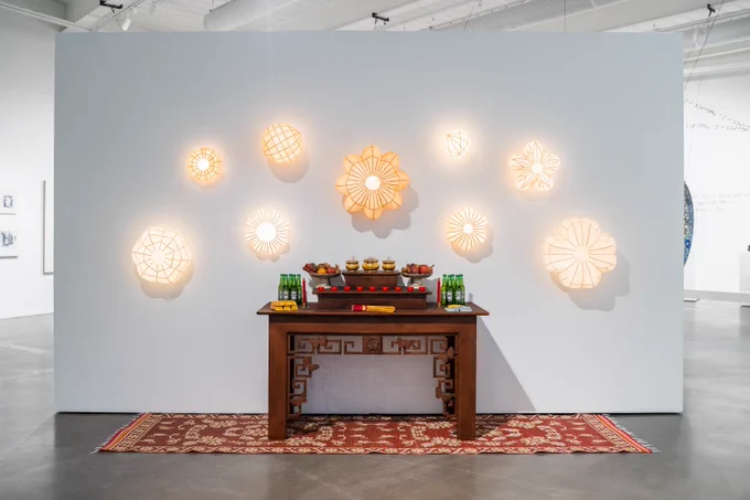 Installation view of ArtNow 2025: Materials and Boundaries, including Đan Lynh Phạm’s I Bear the Fruit of My Ancestors (2024), wall, and Tre Già, Măng Mọc (2025), floor. Photo by Blake Studdard.
