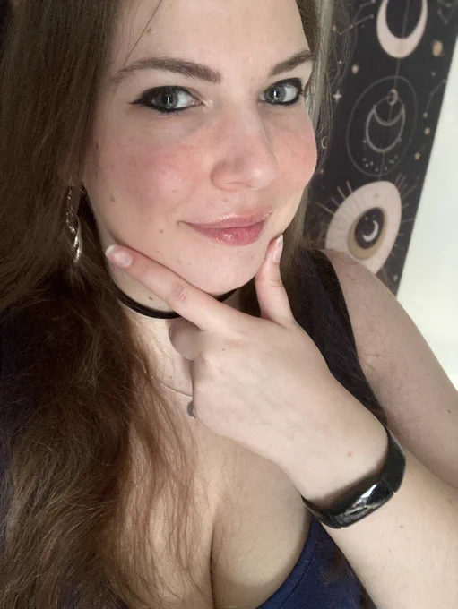 A selfie with a moon banner in the background