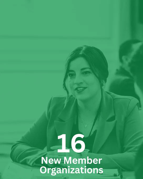 4. Person sitting at a conference table during a meeting, with text overlay stating '16 New Member Organizations'.
