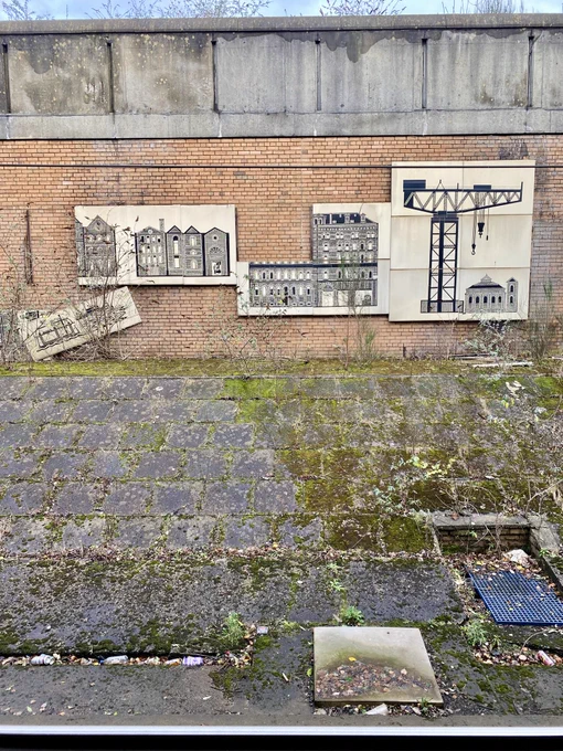 This is a detail of Glasgow artist Willie Rodger’s 1988 mural at Exhibition Centre Station. The 29 panels of the mural depict 100 years of Finnieston’s history but sadly are in a bad way with many having fallen off.