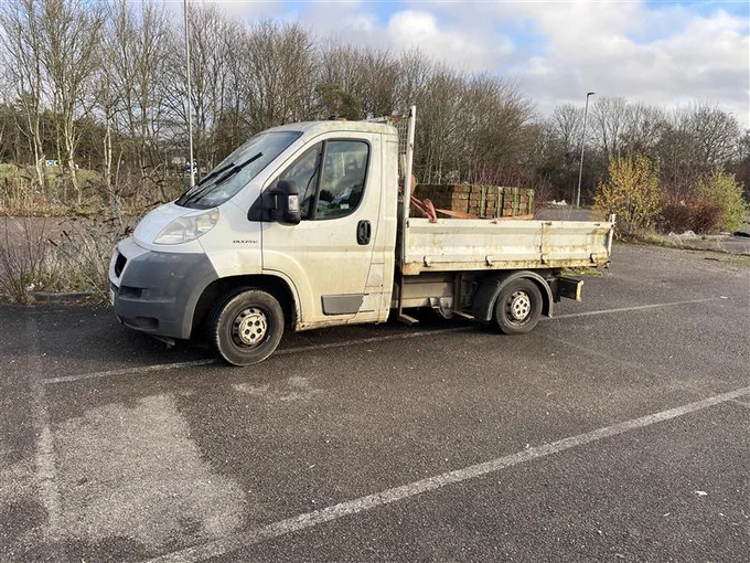 Overweight light goods vehicle carrying sand and bricks. No tailboard fitted which is not road safe compliant to ensure the load does not fall out.