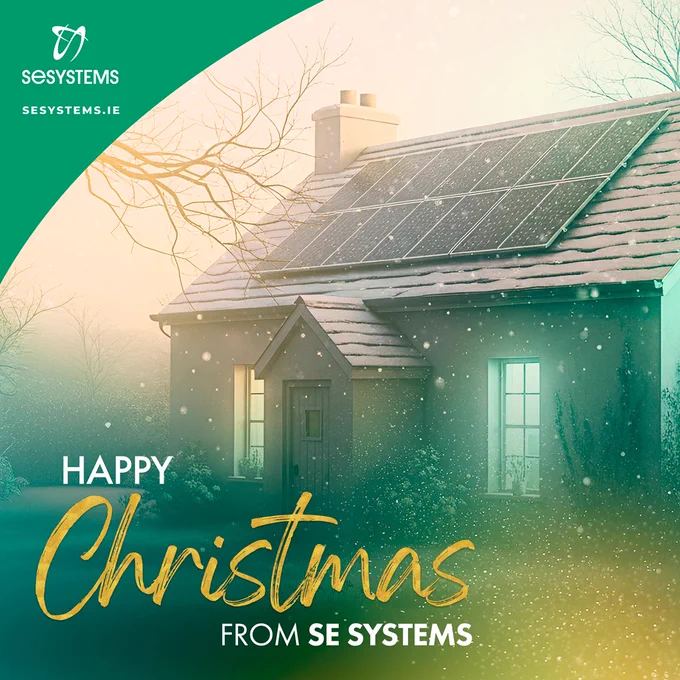 Festive winter scene of a home with solar panels on the roof, softly lit with falling snow. Overlaid text reads ‘Happy Christmas from SE Systems’, with SE Systems branding in the corner.