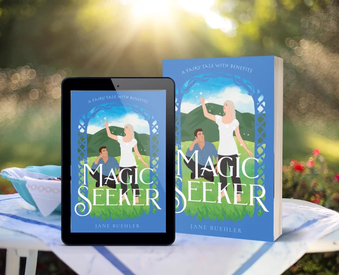 the paperback book and tablet version of The Magic Seeker on a table outdoors with the sun shining low in the sky behind it; the cover shows a woman lifting her arm under the open sky with white sparkles around her while a man sits behind her, smiling and watching her