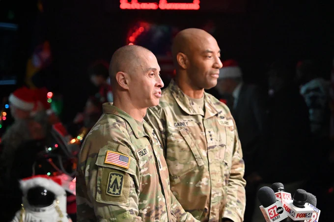 two soldiers are giving an interview to news crew