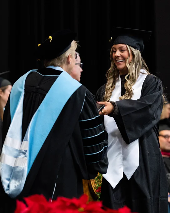 College graduate receives diploma