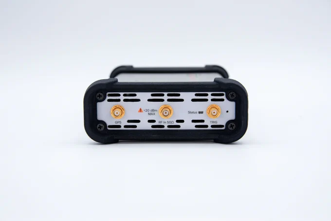 Back view of a SP145 with multiple labeled buttons and ports on a white background.