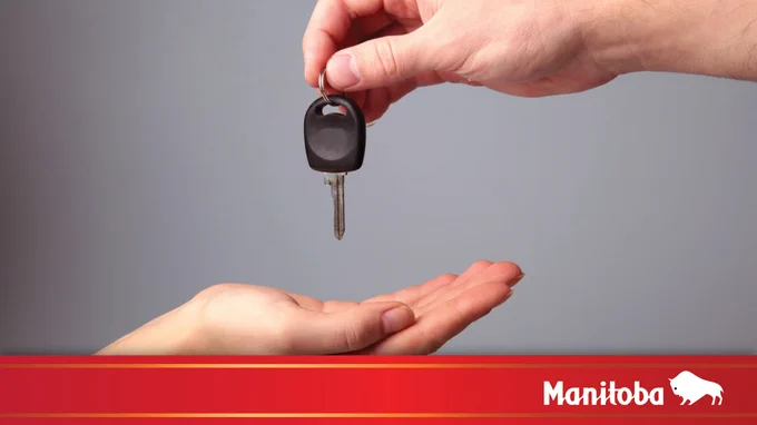 Image of a key being dropped from hand into another.