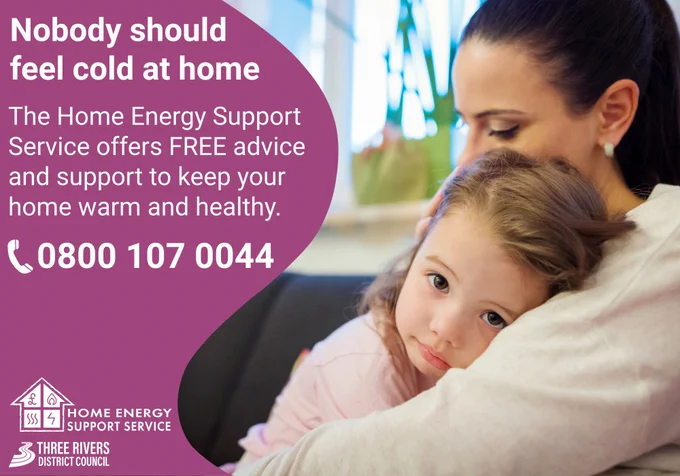 Image of a mum cuddling her young daughter on her lap to stay warm. Text reads, Nobody should feel cold at home. The Home Energy Support Service offers FREE advice and support to keep your home warm and healthy. 0800 107 0044.