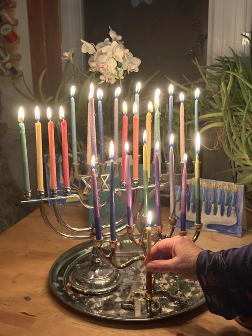 Adding the final candle to our menorah for 2025