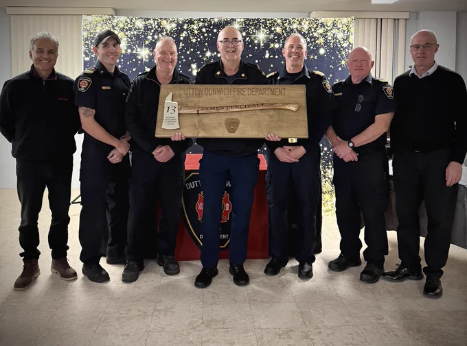 Photo of Captain Percival receiving recognition for 35 years of service.