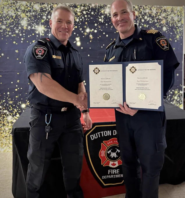 Photo of Firefighter Richardson receiving NFPA 1001 Firefighter Provincial Certification.